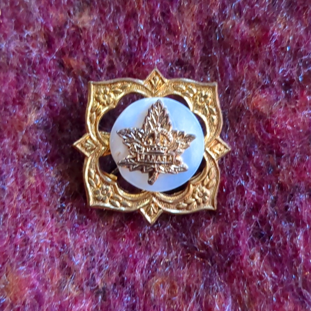 Vintage Canada pin on Mother of Pearl on brass decorative base, no stamps or